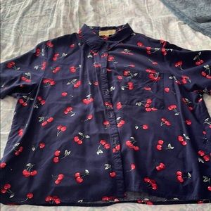 A cropped collared cherry shirt